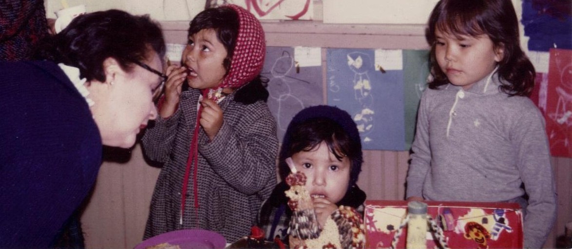 Archival image of children displaying art at a festival decades ago